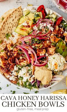 a white plate topped with chicken and veggies next to tortilla chips