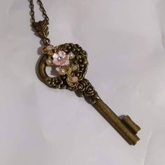 Pretty pink flowers adorn this brass key. Pretty Pink Flowers, Half Skull, Peacock Necklace, Skull Necklace, Key Necklace, Cool Necklaces, Pretty Pink, Pendant Necklaces, Pretty In Pink