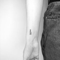 a person with a small tattoo on their arm