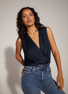 THE SLEEVELESS DATE BLOUSE Padded V-neck Tank Top, Chic Sleeveless Blouse For Night Out, Sleeveless Sleek Blouse For Party, Sleek Sleeveless Blouse For Party, Chic Silk Tank Top For Work, Satin Sleeveless Blouse For Work, Sleeveless Sleek Top For Date Night, Sleek Sleeveless Top For Date Night, Fitted Satin Tops