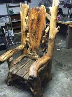 a wooden chair made out of tree branches