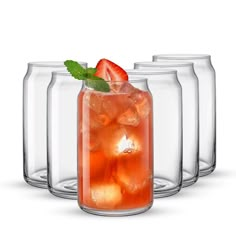 four glass jars with ice and strawberries in them