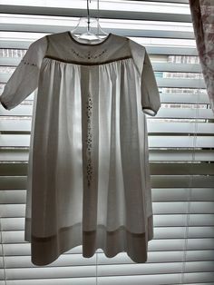 This is a handmade christening gown, or pictures. It has white hand embroidery on the front yoke, sleeves and gown front. There is room for a monogram above the dress embroidery. This gown is made from cotton heirloom lawn. It is machine washable and very durable. It will be beautiful for many generations. This is a size 3-6 mths. I can always give you measurements to be sure it will fit your baby. Short Sleeve Embroidered Dress For Baptism, White Floral Embroidered Dress For Baptism, White Embroidered Dress For Baptism, White Floral Embroidered Baptism Dress, White Floral Embroidery Baptism Dress, White Short Sleeve Baptism Dress For Daywear, White Baptism Dress With Short Sleeves For Daywear, White Embroidered Hem Wedding Dress, Elegant Wedding Dress With Yoke Detail