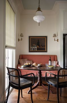 a dining room table with chairs and a couch