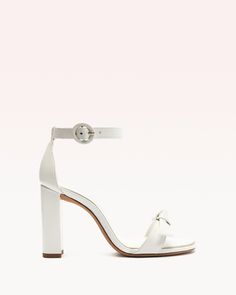 Meet the classic bridal shoe—the Clarita Bridal Block heel. Detailed with our signature Clarita bow and a comfortable 90mm block heel, this timeless style is highly coveted by brides everywhere. Crafted in traditional white leather, this refined and elegant pair is finished with a classic round toe and an ankle-strap closure. Material: Nappa Leather Leather sole Block heel Round open toe Heel height: 3.5in | 90mm SKU: B3503902780002 Glamourous Heels, Designer Wedding Shoes, Bridal Shoe, Wedding 2024, Alexandre Birman, White Shoes, Nappa Leather, Bridal Shoes, Classic White