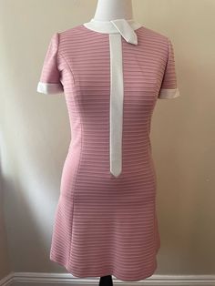 "Vintage 70s pink mod cut dress by Leslie Fay Knits, no size tag. White collar and line down the front of the dress. Zip up back, mini skirt. Short sleeve. Feels like polyester.  Please ask questions!  Measurements (laid flat):  Length: 36\" Pit to Pit: 17\"x2 Waist: 17\"x2 Hips: 19\"x2 Condition: Excellent vintage condition, no issues noted.  The vintage pieces I sell have all led a previous life and may tell their stories through minor imperfections. I'll do my best to indicate overall condition, but please refer to the pictures. Your purchase continues the life of this garment...what stories will you tell while wearing it?  Please note there may be a slight difference in color when comparing the actual garment to the monitor image. (0857)" Mod Cut, Rose Leslie, Cut Dress, Rose Vintage, Skirt Short, Mod Dress, Previous Life, Dress Cuts, White Collar