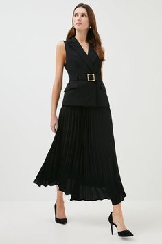 This Dress Is The Epitome Of Modern Elegance. Beautifully Tailored Using A Recycled Polyester Blend, The Piece Gently Defines Your Figure Using Expertly Placed Panelling And A Metal-Trimmed Waist-Cinching Belt. Forming The Appearance Of Sleek Separates, The Waistcoat-Style Bodice Is Layered Over A Pleated Skirt That Falls Gracefully At The Ankle. Finish With Monochrome Accessories For A Deniably Striking Occasionwear Look.  As Part Of Our Mission To Make The World A Better Place, We'Re Being Mor Belted Waistcoat Outfit, Waistcoat And Skirt Outfit, Pleated Dress Outfit Classy, Pleated Dress Outfit, Vest With Skirt, Black Pleated Skirt Outfit, Modern Feminine Style, Waistcoat Style, Classy Midi Dresses