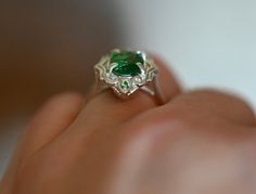 Gorgeous LARGE Green Tsavorite Garnets set in a stunning art deco style setting. This ring has all that glam and drama with the vibrant greens glowing off the high polished silver. There are two small Tsavorite Garnets that sit top and bottom of this ring. If you love rings with drama and color then this is definitely for you, the emerald greens from the natural Tsavorite will spark inspiration and pure joy. Its an all around BOMBSHELL of a ring.This ring is set in a size 8.Tsavorite Garnet: Cla Unique Green Emerald Ring For Formal Occasions, Polished Emerald Ring For Wedding, Elegant Tsavorite Rings With Polished Finish, Green Sterling Silver Art Deco Jewelry, Green Tsavorite Wedding Rings, Art Deco Green Jewelry With Accent Stones, Green Art Deco Jewelry With Accent Stones, Exquisite Green Emerald Sterling Silver Ring, Unique Green Tsavorite Emerald Ring