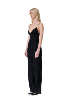 A pinstripe straight leg trouser with front pleat, fully lined, belt loops, and front zip button closure. This item is made to order. Any expedited requests please email support@odette-odile.com. Material: Self 50% Wool, 50% Polyester; Lining 100% Silk. Fit: Model is 5'9, wearing size XS Care Instructions: Dry Clean Only Do Not Bleach Do Not Tumble Dry Cool Steam Only Straight Leg Trousers, Black Pants, Steam, Care Instructions, Shopping Outfit, Bleach, Straight Leg, Dry Clean, Trousers