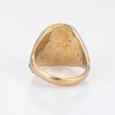 Stylish vintage Egyptian Pharaoh signet ring (circa 1960s to 1970s) crafted in 14 karat yellow gold.    The nicely detailed ring highlights the mystique of ancient Egypt. The ring is designed to pay homage to the enigmatic Pharaohs who once ruled the banks of the Nile. The side shoulders depict snakes that coil and curve, a sign of protection and an emblem of immortality. The ring is a symbol of the Pharaohs connection to the divine and their role as intermediaries between the earthly and divine realms. The low rise ring (4.5mm - 0.17 inches) sits comfortably on the finger.    The ring is in very good condition. We have not cleaned it in order to preserve the patina and collector value.    Particulars:    Weight: 12.9 grams    Stones:    Size & Measurements: The ring is a size 6 1/2 (sizab Vintage Ceremonial Signet Ring With Open Design, Vintage Ceremonial Open Signet Ring, Classic Open Signet Ring Collectible, Vintage Ceremonial Open Ring, Antique Gold Dome Ring With Polished Finish, Vintage Ceremonial Rings With Antique Finish, Vintage Ceremonial Ring With Antique Finish, Ceremonial Vintage Ring With Antique Finish, Vintage 14k Stamped Rings For Ceremonial Occasions