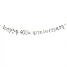 a happy 60th birthday banner hanging from a string