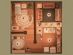 an overhead view of a living room and kitchen area in a small apartment with wood flooring