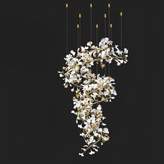 a chandelier with white flowers hanging from it's sides on a black background