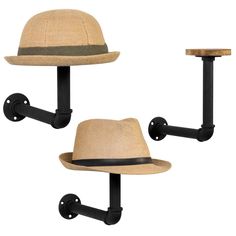 two hats are mounted on the wall with black iron brackets and hooks, one has a hat