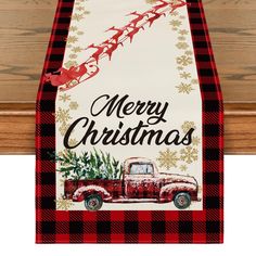 a red and black christmas truck with santa's sleigh on it