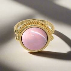 This stately ring is quintessentially classic in design, and is based on several Roman examples dating to the first and second centuries AD found in Bay of Naples towns, and in areas that were at one point known as Roman Britain. Its focal point is a prominent round stone in a bezel setting, which is crowned by a brilliant ribbed border. "Dignitas" was an important and serious concept in the Roman world - and something to which all Romans aspired - though it is difficult to define today. It mean 14k Gold Dome Ring With Cabochon, Elegant Cabochon Moonstone Open Ring, 14k Gold Rings With Cabochon Round Stone, Timeless Round Moonstone Ring Gift, Timeless Round Moonstone Ring As Gift, 14k Gold Cabochon Ring With Round Band, 14k Gold Cabochon Rings With Round Band, Adjustable Gemstone Signet Ring, Formal Cabochon Ring With Round Stone