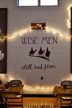 a wall that has some lights on it with the words wise men still seek him