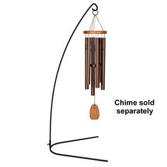 a wind chime hanging from the side of a metal pole with a wooden pendulum on it