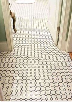 an image of a tiled floor in the hallway