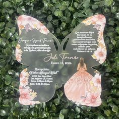 the back side of a butterfly shaped wedding card