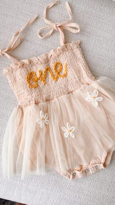 Beautiful one romper for your babe's first birthday celebration. includes 3 daisy flowers on the tutu skirt Birthday photoshoots, special events, etc. If you'd like a different color or saying, don't hesitate to contact us 1st Birthday Girl Outfit Ideas, A Year In Bloom First Birthday, Blooming One Birthday Party, Isn’t She Onederful Birthday Daisy, Daisy Flower First Birthday, Dainty First Birthday, Spring One Year Old Birthday Party, Boho Daisy First Birthday Theme, Fairy First Birthday Outfit