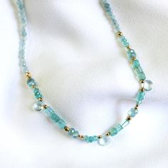 "Natural Aquamarine Necklace for Women, Handmade Jewelry Stunning and chic this beaded aquamarine necklace is the perfect everyday necklace or gift.  Aquamarines are a symbol of courage.  D E T A I L S *Gorgeous, genuine and natural aquamarine with touches of apatite beaded by hand  *Adorned with 14kt gold filled accents   Water friendly  LENGTH  *Choose a 16 inch length of a 16 inch with a 2 inch extender for up to 18 inches.  *Model is wearing 16\" in photos.  HOW TO PERSONALIZE *Select your choices from the drop down menu to create your custom design. ∙ EXTRA LOVE ∙ Handcrafted just for you in sunny Arizona by a team of talented women. All of our jewelry comes gift packaged! We are happy to leave a note if this is a special gift, just let us know in the message box at checkout. PRODUCTI Aquamarine Bead Necklaces For Gifts, Aquamarine Round Beads Necklace For Gift, Turquoise Aquamarine Round Bead Necklaces, Large Gift Boxes, Aquamarine Necklace, Aquamarine Jewelry, Jewelry Birthday, Large Gift, Everyday Necklace