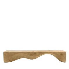 an unfinished wooden shelf against a white background