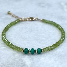 Green peridot gemstone bracelet with turquoise and 14k gold filled accent beads. Shimmering, sparkly and irresistible, this is the   perfect accessory to match your look today!  Details~ * All metals used are 14k gold filled,  made to last for years to come.  * Length: Bracelets are finished with a 14k gold-filled lobster clasp and extender chain, making them adjustable in length. I offer two    size options: Sm. 6 1/2 - 7 1/2 inches or Med. 7 1/2 - 8 1/2 inches * Packaging: Your order will arri Chrysoprase Gemstone Jewelry With Round Beads, May Birthstone Faceted Round Beads Jewelry, Hand-strung Chrysoprase Jewelry Gift, Peridot Gemstone Beads Jewelry, Green Gemstone Beaded Bracelets For May Birthstone, Green Gemstone Rondelle Beaded Bracelets, Green Gemstone Rondelle Jewelry, Green Gemstone Beads Bracelet For May Birthstone, Green Rondelle Gemstone Jewelry