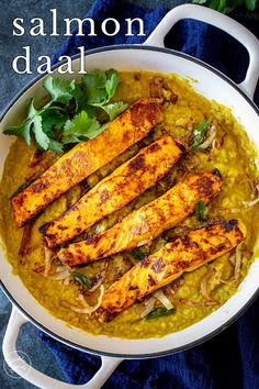 the cover of salmon daal is shown in a pan