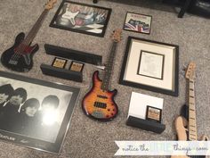 an assortment of musical instruments and memorabilia on the floor