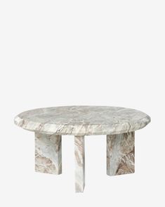 an oval marble table with two legs on each side and a circular base in the middle