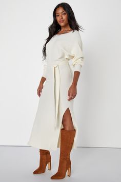 The Lulus Cozy Captivation Ivory Ribbed Dolman Sleeve Midi Sweater Dress is perfect for looking a little extra flirty while sitting fireside this season! Stretchy, ribbed sweater knit shapes a flattering boat neckline and dolman-style sleeves with fitted cuffs. A matching tying sash cinches at the waist of the figure-flaunting bodycon silhouette, that falls to a midi hem with side seam slits. Fit: This garment fits true to size. Length: Mid-calf length. Size medium measures 50.5" from shoulder t Chic Cream Dress For Loungewear, Oversized Cream Dress For Fall, Off White Fall Dresses For Daywear, Off White Dress For Fall Daywear, Off White Dresses For Fall Daywear, Off White Dresses For Daywear In Fall, Long Cream Dress For Fall, Long Cream Dresses For Fall, Sweater Midi Dress