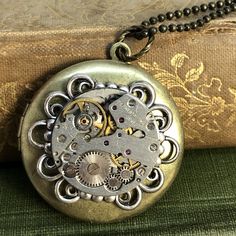 Beautifully detailed swirl round frame highlights this vintage round watch movement. What a great locket to save your favorite photos. Timless and elegant steampunk locket . Fantasy Locket, Elegant Steampunk, Book Locket Necklace, Watch Locket, Moon Goddess Necklace, Filigree Frame, Goddess Necklace, Pocket Watch Antique, Vintage Pocket Watch