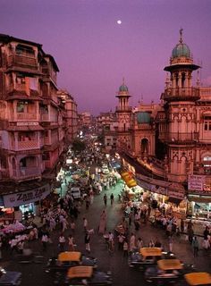 an aerial view of a busy city street at dusk