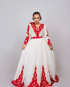 This Habesha dress is a true work of art, made of soft and luxurious Menen fabric in a regal red color. The dress features a stunning Tilf embroidery design, covering the entire dress with intricate patterns and designs that are unique to Ethiopian traditional clothing. The Tilf embroidery adds a touch of elegance and sophistication to the dress, featuring delicate patterns and designs that are sure to turn heads. The dress is designed with a fitted bodice that accentuates the waistline and flar Ethiopian Cultural Clothes, Cultural Clothes, Ethiopian Clothing, Habesha Dress, Ethiopian Traditional Dress, Ethiopian Dress, Habesha Kemis, Dress Embroidery, Wedding Dress Chiffon