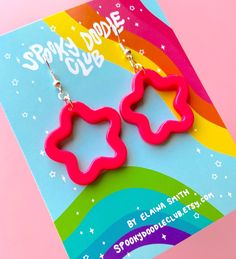 These hot pink plastic star earrings are an affordable statement jewelry piece. Shine bright with these star earrings! They'd easily compliment any 80s-inspired outfit or neon ensemble.  Measuring approximately 1.5 inches long, these lightweight earrings offer a comfortable and effortless wear. Crafted with nickel-free components, they are perfect for those with sensitive ears, ensuring a worry-free experience. Whether you're shopping for yourself or looking for a gift for someone special, these chunky pink dangle earrings are sure to be the perfect piece! Items are shipped within 1-3 business days. We try to be eerily quick! Have any questions about this item or need help placing your order? Please message me via Etsy! I'm happy to help. :) Come join my club! We'd love to have you! ~ Spoo Pink Star Earrings For Party, Pink Star-shaped Party Earrings, Pink Star Charm Dangle Earrings, Pink Plastic Drop Earrings, Pink Dangle Earrings With Star Charm, Playful Pink Plastic Earrings, Playful Pink Jewelry With Star Charm, Trendy Pink Star-shaped Jewelry, 80s Inspired Outfits