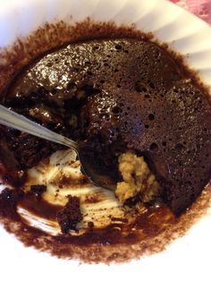 a white bowl filled with chocolate pudding and ice cream