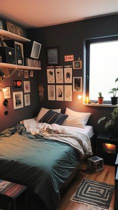 a bed sitting in a bedroom next to a window with pictures on the wall above it