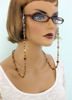 "Brown beaded Eyeglass Chain, and Necklace combination handmade by Ralston Originals. This is a unique original style Glasses Chain and Necklace combination designed by Ralston Originals. Unique from any other Glasses Chains on Etsy, Ralston Originals was the first to add the lobster clasp at the end of the chain to join together to make a Necklace. Brilliant! This makes it even more unique because you now have two pieces of jewelry in one!! Wear it to work or out shopping as a Necklace, then we Glasses Necklace Holder, Handmade Brown Glass Jewelry, Handmade Brown Glass Beaded Necklaces, Wire Wrapped Round Glass Beaded Necklaces, Brown Glass Beaded Necklaces For Gifts, Brown Glass Beaded Necklaces As Gift, Unique Glass Beaded Necklaces, Adjustable Chain Glass Beaded Necklaces For Jewelry Making, Adjustable Glass Beaded Necklaces With Wire Wrapping