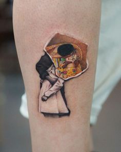 a woman's leg with a piece of artwork on it