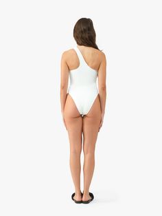 Meet Margot. With its striking asymmetrical neckline and high-cut leg silhouette, this one-piece swimsuit makes a bold statement. Asymmetrical Neckline Bodysuit For Summer, Chic One Shoulder Bodysuit For Swimming, Stretch Bodysuit With Asymmetrical Neckline And Lined Body, Stretch One Shoulder Bodysuit For Beachwear, One-shoulder Bodysuit For Pool, Chic Swimwear With Asymmetrical Neckline And Lined Body, Chic Asymmetrical Lined Swimwear, Fitted Bodysuit With Asymmetrical Neckline For Swimming, Chic Asymmetrical Neckline Swimwear With Lined Body