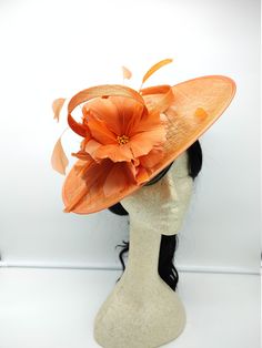 "Beautiful orange saucer Kentucky derby style Fascinator on a confidence comfortable 2\"wide headband, adorn with flowers and feathers. - Ready to ship - Lightweight - Free Shipping - Fast shipping - Customize by adding different color flowers and or feathers Check my store for styles and colors. Hatsandpearls.etsy.com Find more at my website: Www.hatsandpearls.com Reach out to me if you can't find what you are looking for. I can make cake custom orders and help you style and match your outfit T Orange Short Brim Hat For Spring, Orange Headpiece For Kentucky Derby Races, Orange Headpieces For Kentucky Derby Races, Summer Feather Fascinator With Adjustable Fit, Orange Fitted Headpiece For Kentucky Derby, Orange Mini Hat For Kentucky Derby Races, Elegant Orange Headpiece For Spring, Elegant Orange Adjustable Hat, Elegant Orange Summer Costume Hat