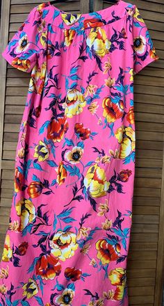 This stylish handcrafted, short sleeve, A-line maxi dress has large, bright blooms scattered across a bright pink background by HibiscusHawaiian on Etsy Traditional Hawaiian Dress, Bright Pink Background, Hawaiian Clothing, A Line Maxi Dress, Hawaiian Outfit, Hawaiian Dress, Floral Theme, Pullover Designs, Dress Clothes For Women