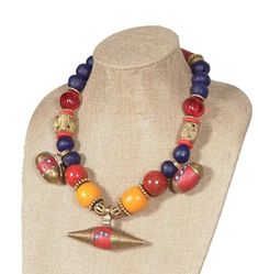 Indulge in the timeless beauty of our handcrafted African beaded necklace. This unique piece features a captivating blend of vibrant colors, textures, and high-quality materials. Key Features: Eye-Catching Design: The striking combination of Malian pendants, Ghana brass, Krobo beads, and other materials creates a bold and eye-catching statement piece. High-Quality Materials: Crafted with durable glass beads, brass, and recycled materials. Versatile Style: Perfect for both casual and formal occasions. Adjustable Length: The 19.5-inch length allows for a comfortable Ξt.Ethical and Fair Trade: Support sustainable and ethical practices with this handcrafted necklace. Add a touch of global Οair to your wardrobe and make a statement with our Chunky African Beaded Necklace. Order yours today! African Beaded Necklace, Krobo Beads, African Beads Necklace, Brass Antique, Jewelry Blue, African Beads, Handcrafted Necklace, Wedding Jewellery Necklace, Brass Pendant