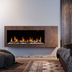 a modern fireplace in a living room next to a bed