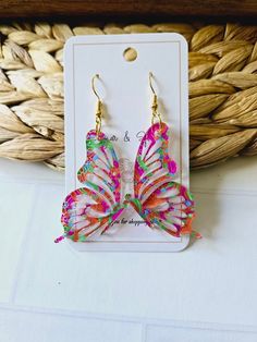 Introducing our Butterfly Acrylic Pink and Orange Swirl Earrings, a true work of art for your ears. Crafted from high-quality acrylic, these earrings feature a beautiful and unique rainbow swirl design resembling the graceful butterfly wings. Add a touch of elegance and sophistication to any outfit with these exquisite earrings. Hypoallergenic hook. Acrylic pattern (varys with each earring) Earrings measure 2" long. CARING FOR YOUR JEWELRY: * Please remove earrings before bathing and swimming. Material: Hypoallergenic Earring Hooks. Nickel-free with anti-allergy can be used for sensitive skin REFUNDS/EXCHANGES We cannot offer exchanges on earrings due to sanitary conditions of wearing in earlobe. If you item is damaged during shipping, we will be happy to replace your item! Please provide Acrylic Pink, Earrings Butterfly, Butterfly Wing Earrings, Earrings Hypoallergenic, Swirl Earrings, Rainbow Swirl, Butterfly Wing, Wing Earrings, Hypoallergenic Earrings