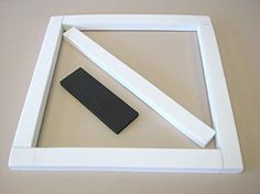 a white frame with a black object in it