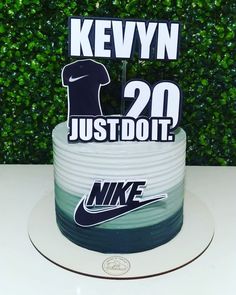 a birthday cake with the number twenty two on it and nike stickers in front