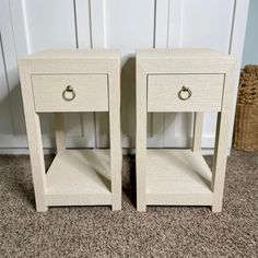 two white nightstands side by side on carpeted floor