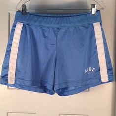 Nwot Nike Women’s Size Large Blue Athletic Shorts, Mesh With White Strips And Logo, Never Worn, 100% Polyester, Inside Tie Front, Nike Blue Sporty Shorts, Blue Sporty Athletic Shorts For Spring, Blue Athletic Shorts With Elastic Waistband For Spring, Sporty Blue Athletic Shorts For Spring, Blue Nike Athletic Shorts, Nike Blue Athletic Shorts, Blue Fitted Casual Athletic Shorts, Nike Blue Athletic Shorts For Spring, Nike Blue Bottoms With Elastic Waistband